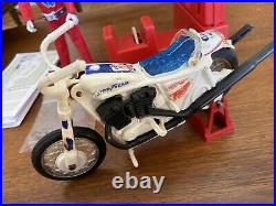 1975 Ideal EVEL KNIEVEL Stunt Cycle Figure, Energizer, Swagger Stick & Stunt Bar