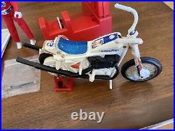 1975 Ideal EVEL KNIEVEL Stunt Cycle Figure, Energizer, Swagger Stick & Stunt Bar