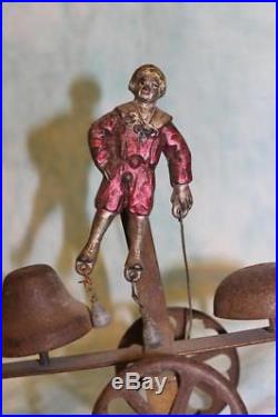 Antique Bell pull toy 1890s Boy and Girl figures, with weights that hit Bells