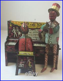 Antique HAM AND SAM The Minstrel Team wind up toy complete with figures