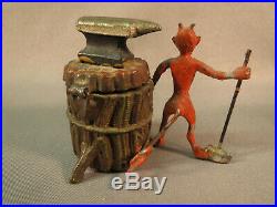 Antique Heyde figure of Devil with sledge hammer & anvil, by a tree trunk inkwell
