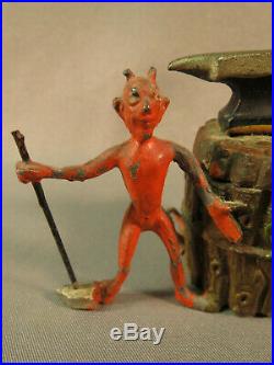 Antique Heyde figure of Devil with sledge hammer & anvil, by a tree trunk inkwell
