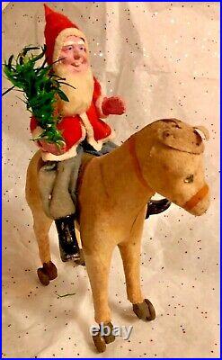 Antique VTG Composition Santa Riding Cloth Glass Eyed Donkey On Wheels Pull Toy