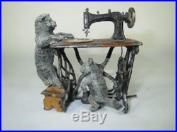 Complex Heyde figure large cat at a treadle sewing machine, kitten on treadle