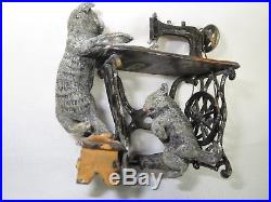 Complex Heyde figure large cat at a treadle sewing machine, kitten on treadle