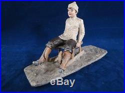 Unusual Heyde figure of a boy on an old style sled, winter or Christmas figure